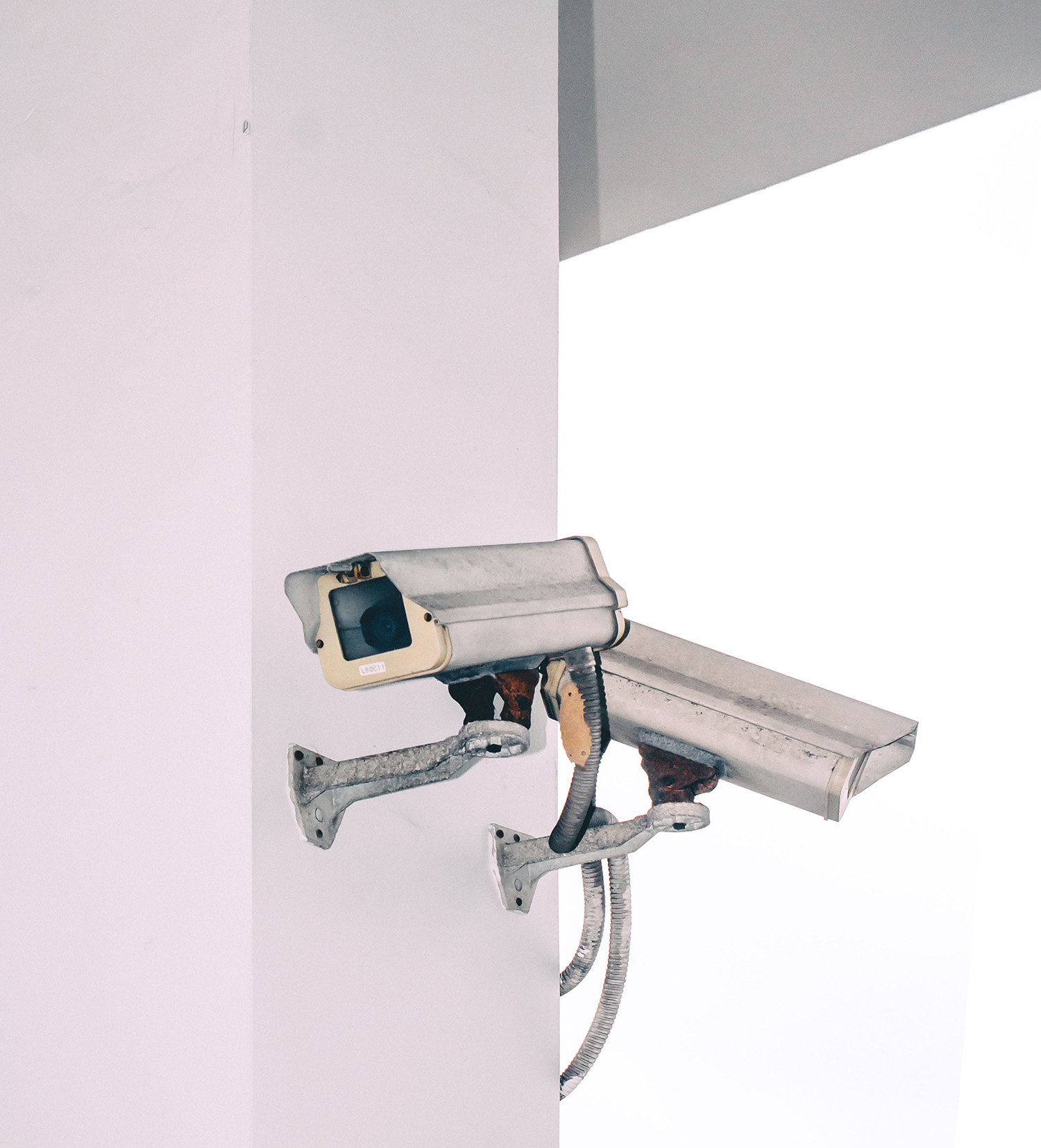 Home security cameras on the side of a Florida home.