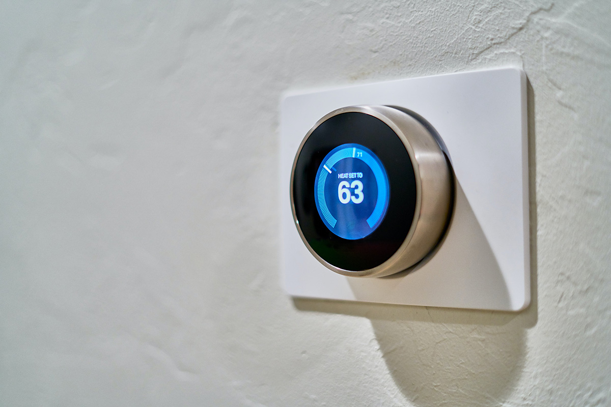 A smart thermostat on the wall as a smart home automation.